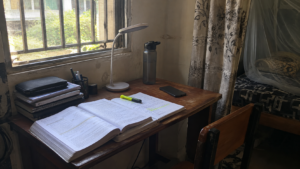 Distraction-free study corner set up by the window in a shared UNN hostel room